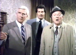 Police Squad!'s leads. That's Leslie Nielsen on the left. Now you remember?
